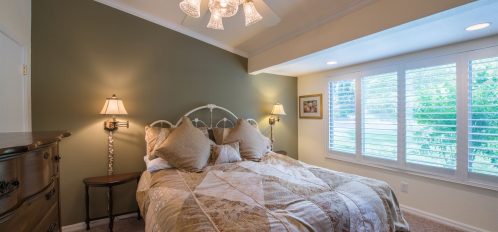 Golfer's Getaway - Interior - Bedroom with checkered tan and peach linens