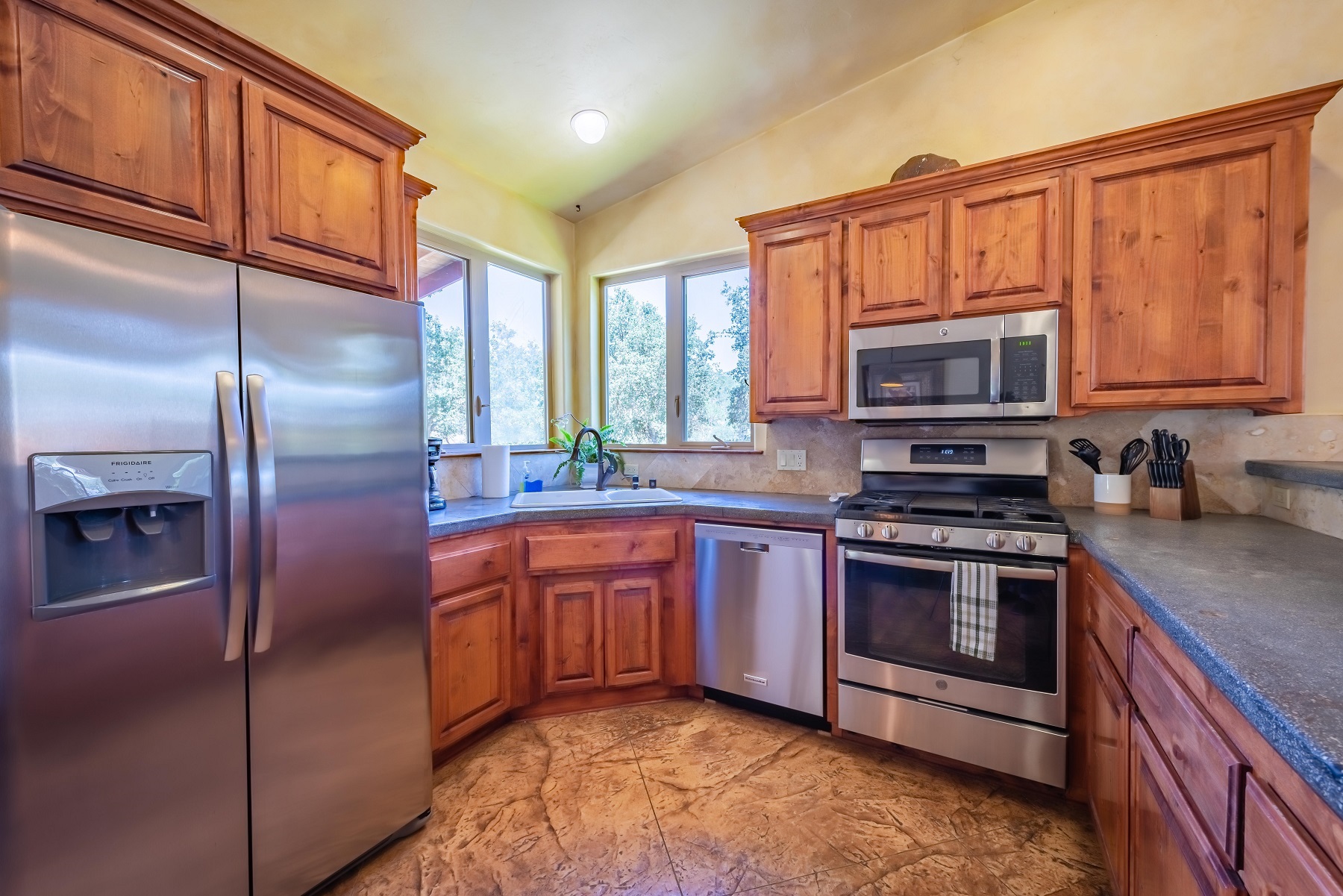 Stainless steel appliances and ample counter space for working.