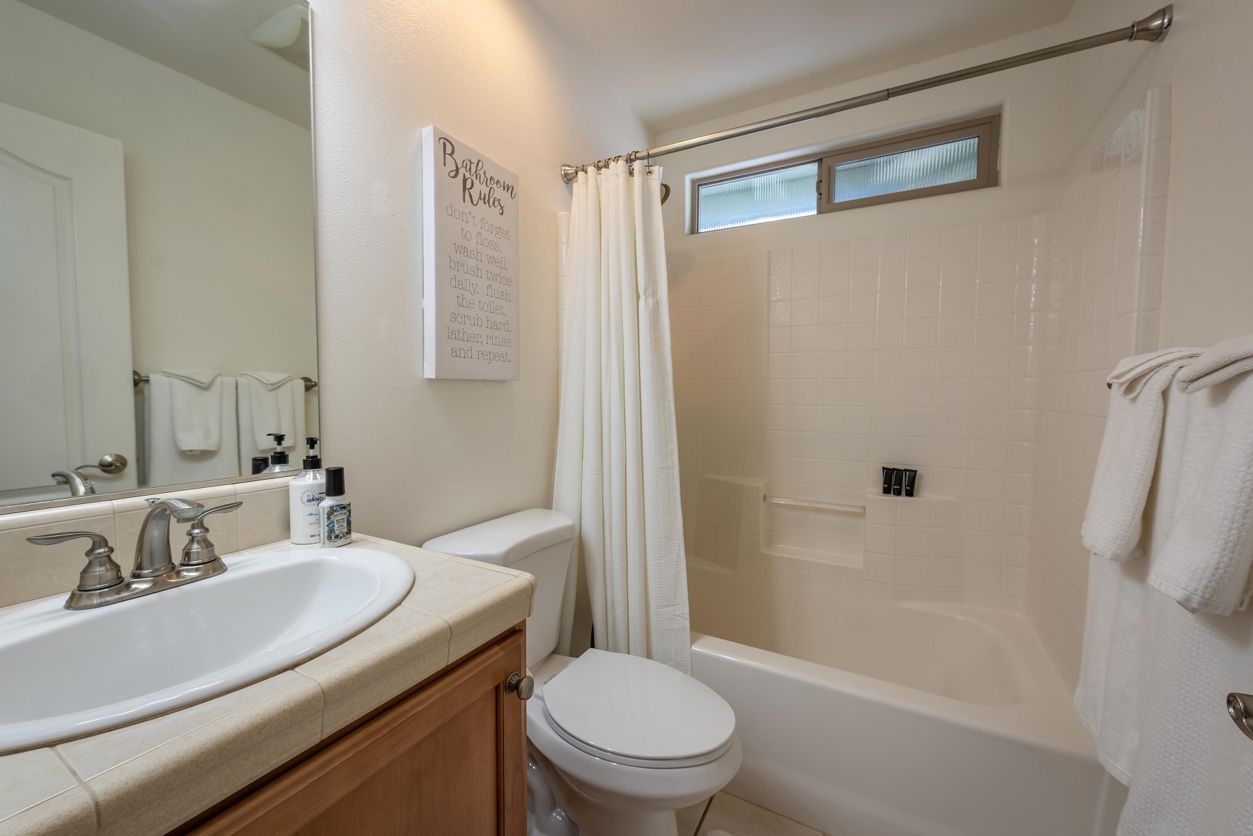 Full bath with tub/shower combo, shared by Bedroom 2 & 3