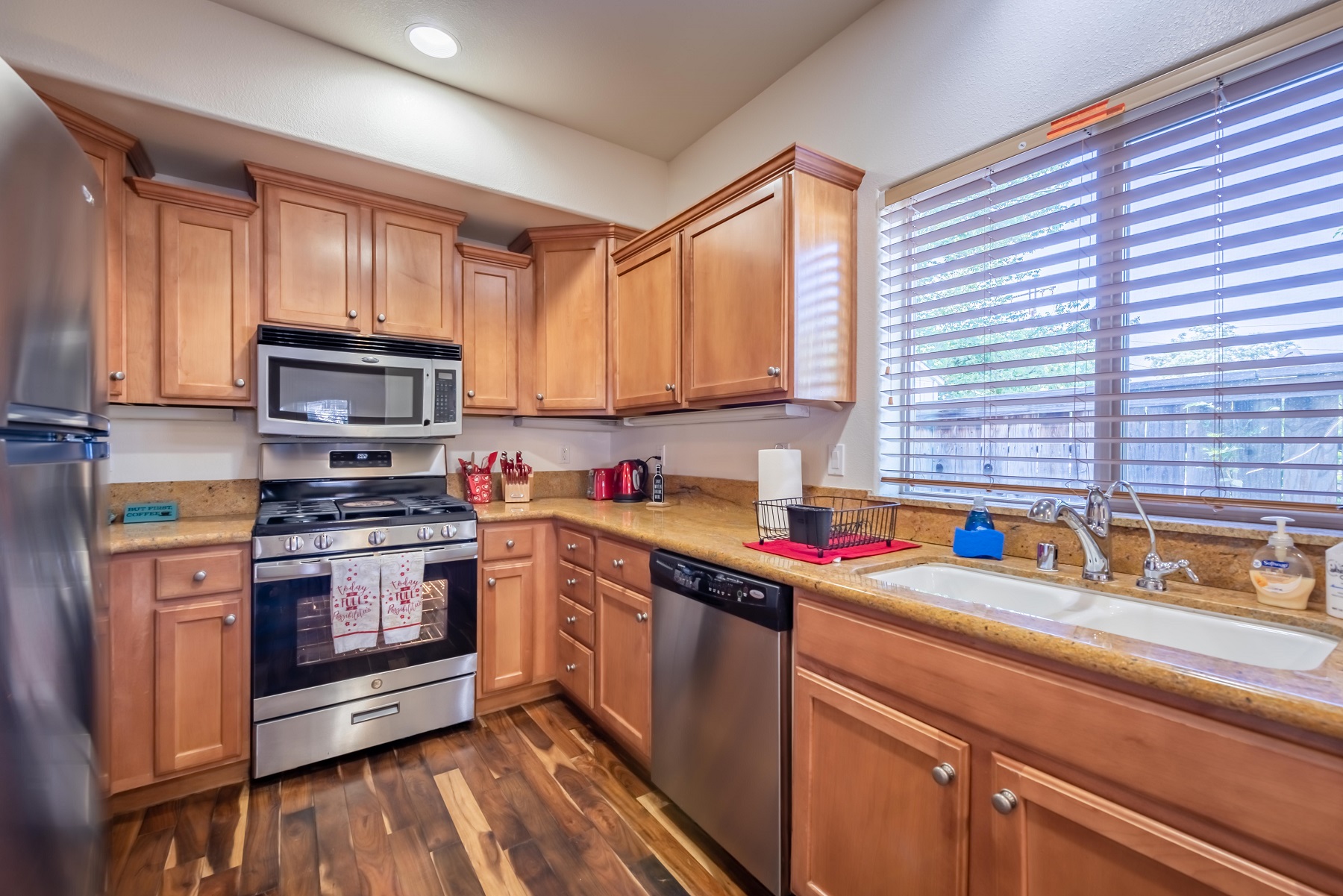 Kitchen with Stainless steel appliance, 4-burner stovetop with center griddle, dishwasher, microwave and all the essentials to cook up a storm.