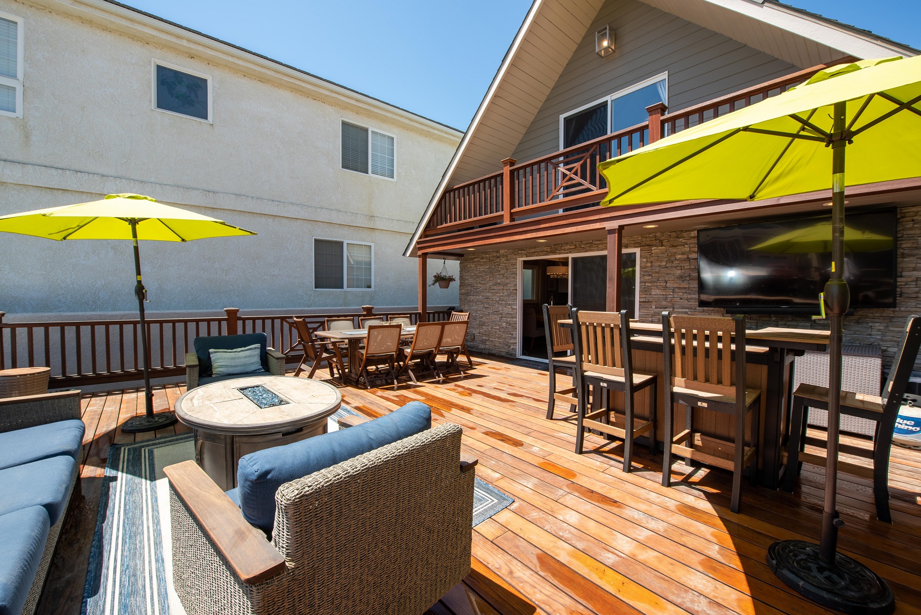Entertainment deck with Fire pit, bar, dining table with seating for 8 and a hot tub!
