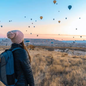 woman looking at balloons