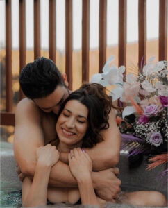 Discover the best things for couples to do in SLO County like heading to the River Oaks Hot Springs Spa like this couple enjoying the hot springs outside.