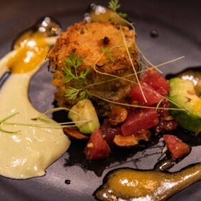 Food on Black Plate Designed Elegantly